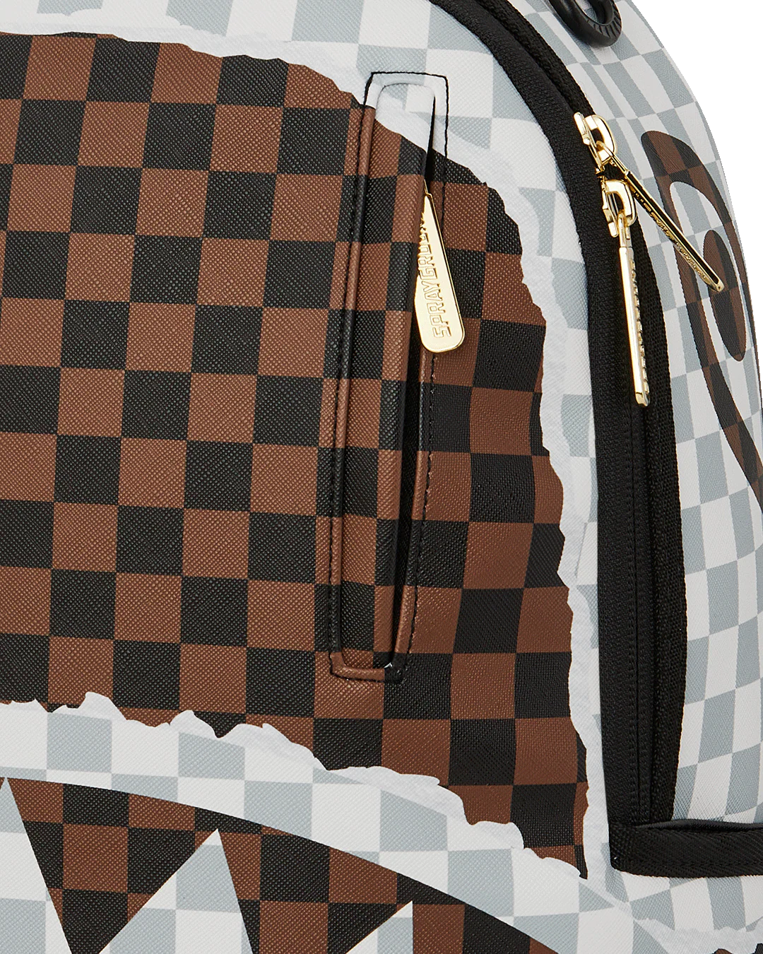 Close-Up View of the Sprayground Cream And Brown Tear Check Backpack