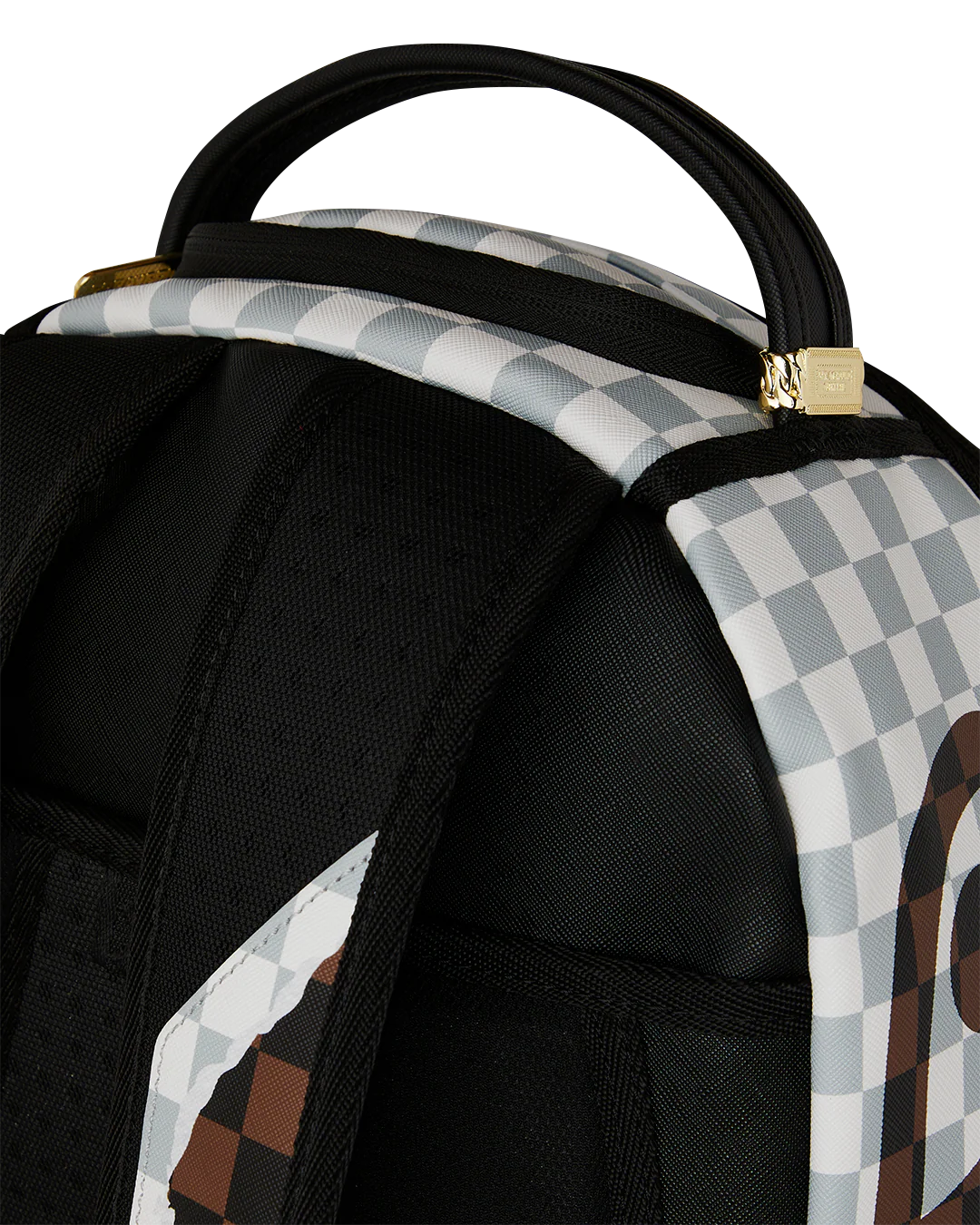 Close-Up Top View of the Sprayground Cream And Brown Tear Check Backpack