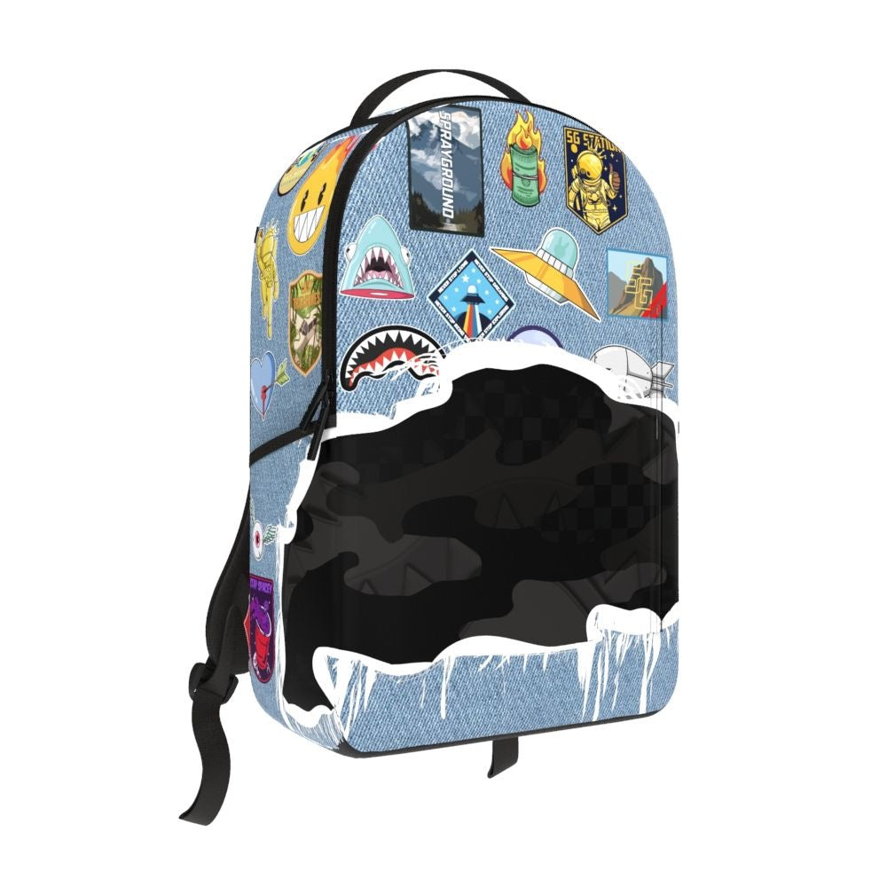 Front Left View of the SprayGround Denim Tear 3 AM Patches Backpack
