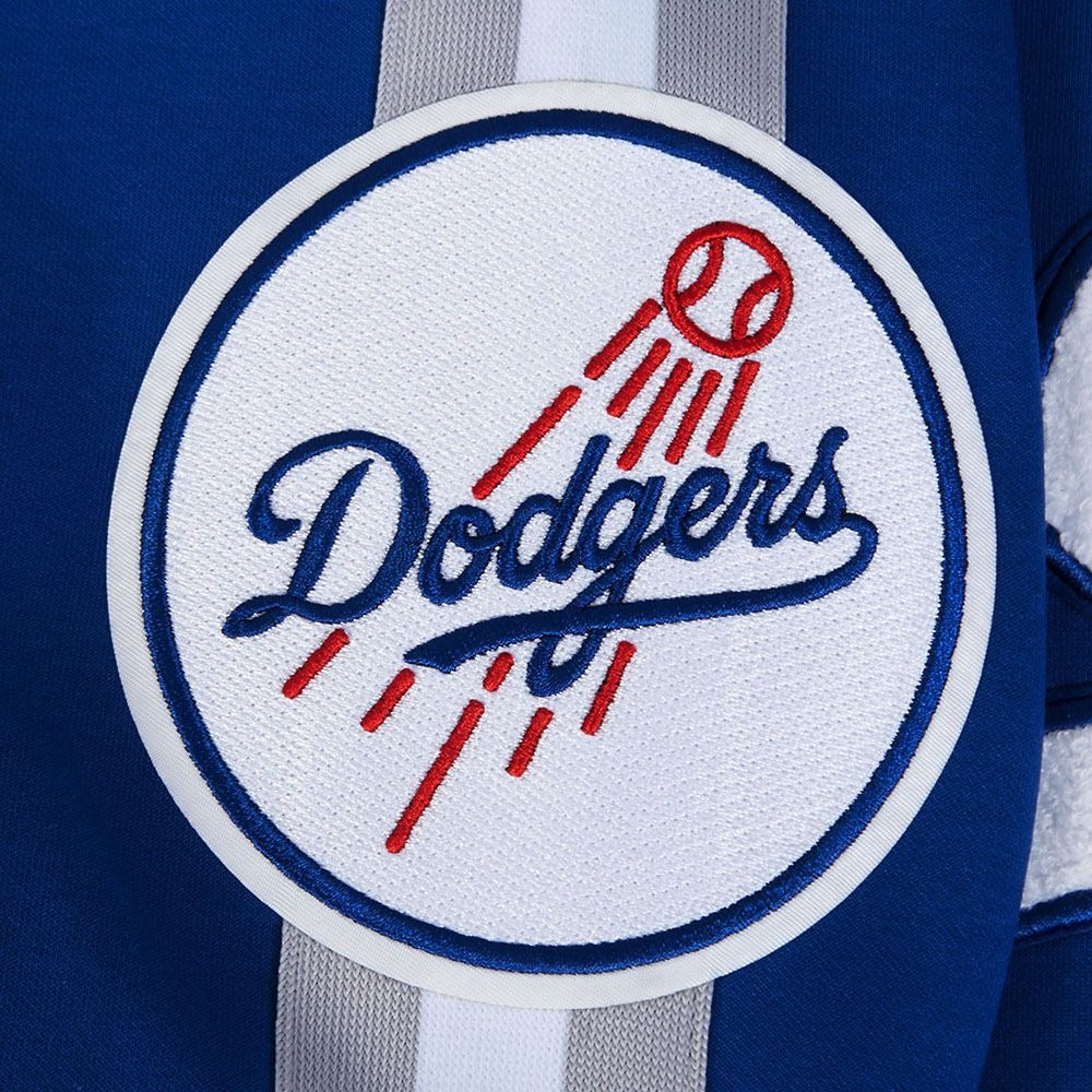 Close-Up View of the Dodgers Ball logo on  the LOS ANGELES DODGERS MEN'S JACKET PRO GAME DAY JACKET in blue