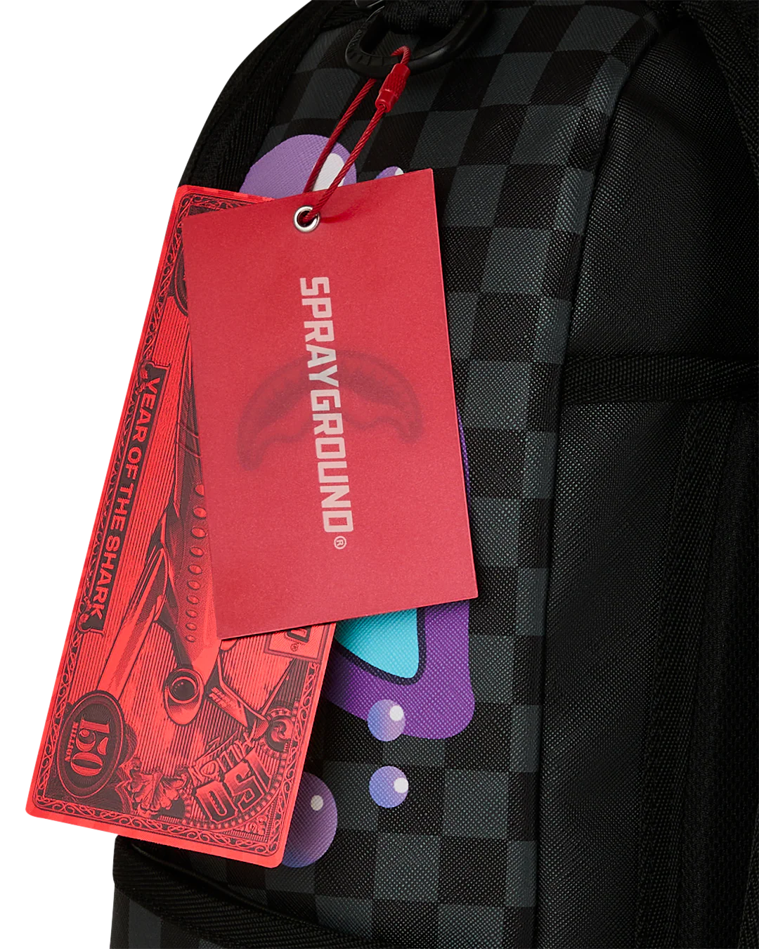 Close Up Tag View of the Sprayground Purple Slime Takeover Backpack