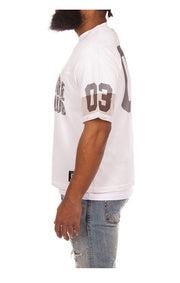 Left side view of BBC Varsity SS Tee in White- Men's Varsity Tee