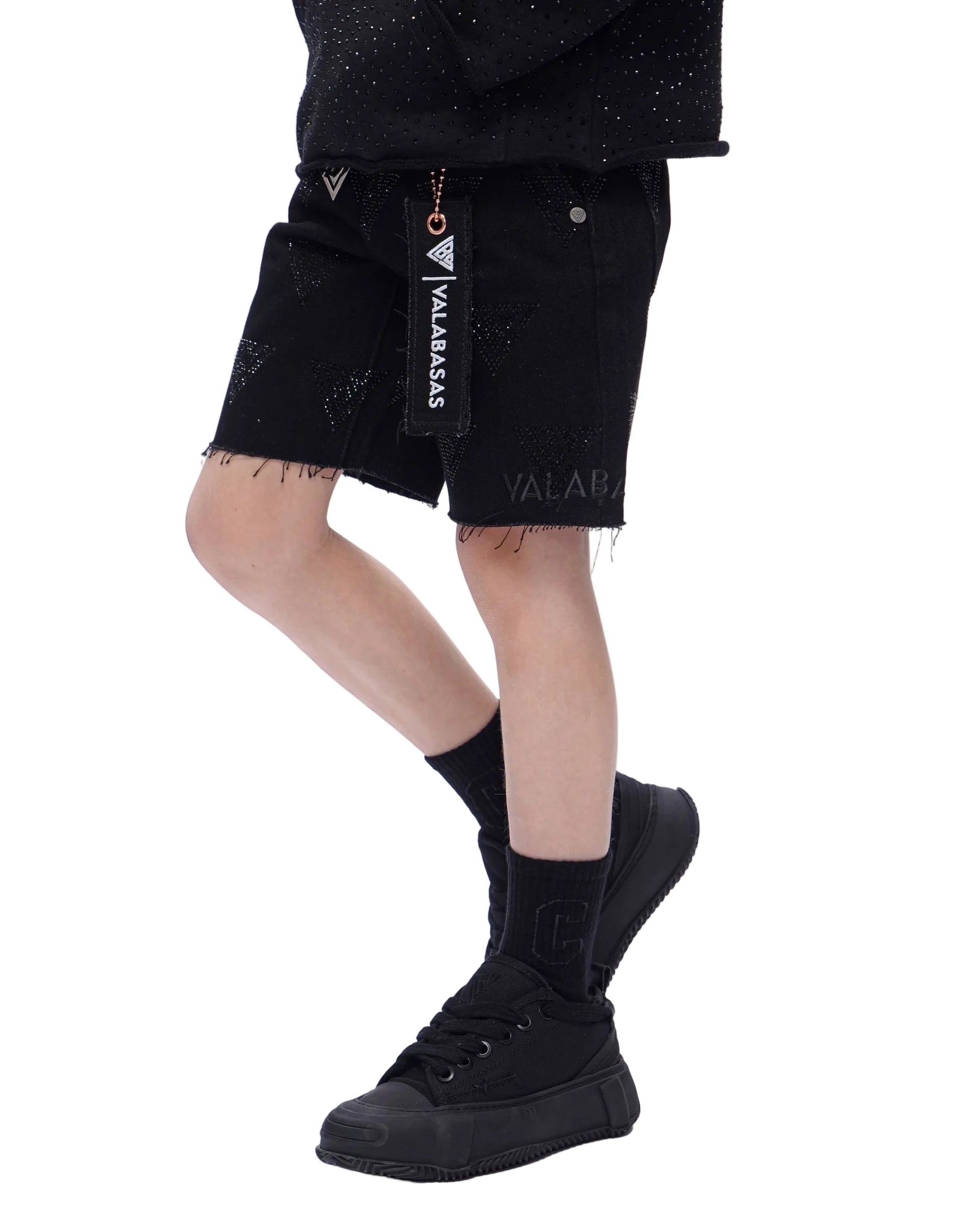 Left Side View of the Valabasas Kids “PALACE” Denim Shorts In Black